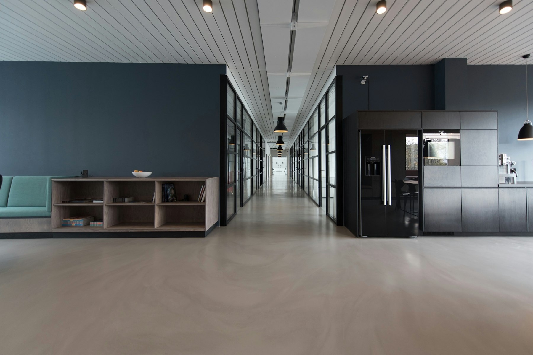 A bright modern office with multiple monitors