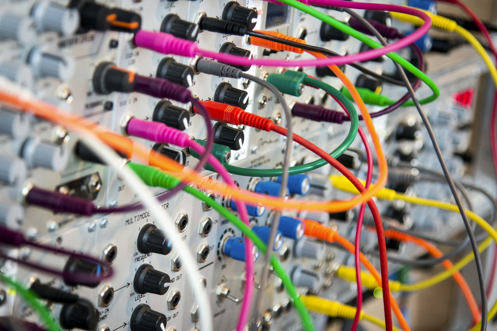 A close-up of a network switch with connected cables