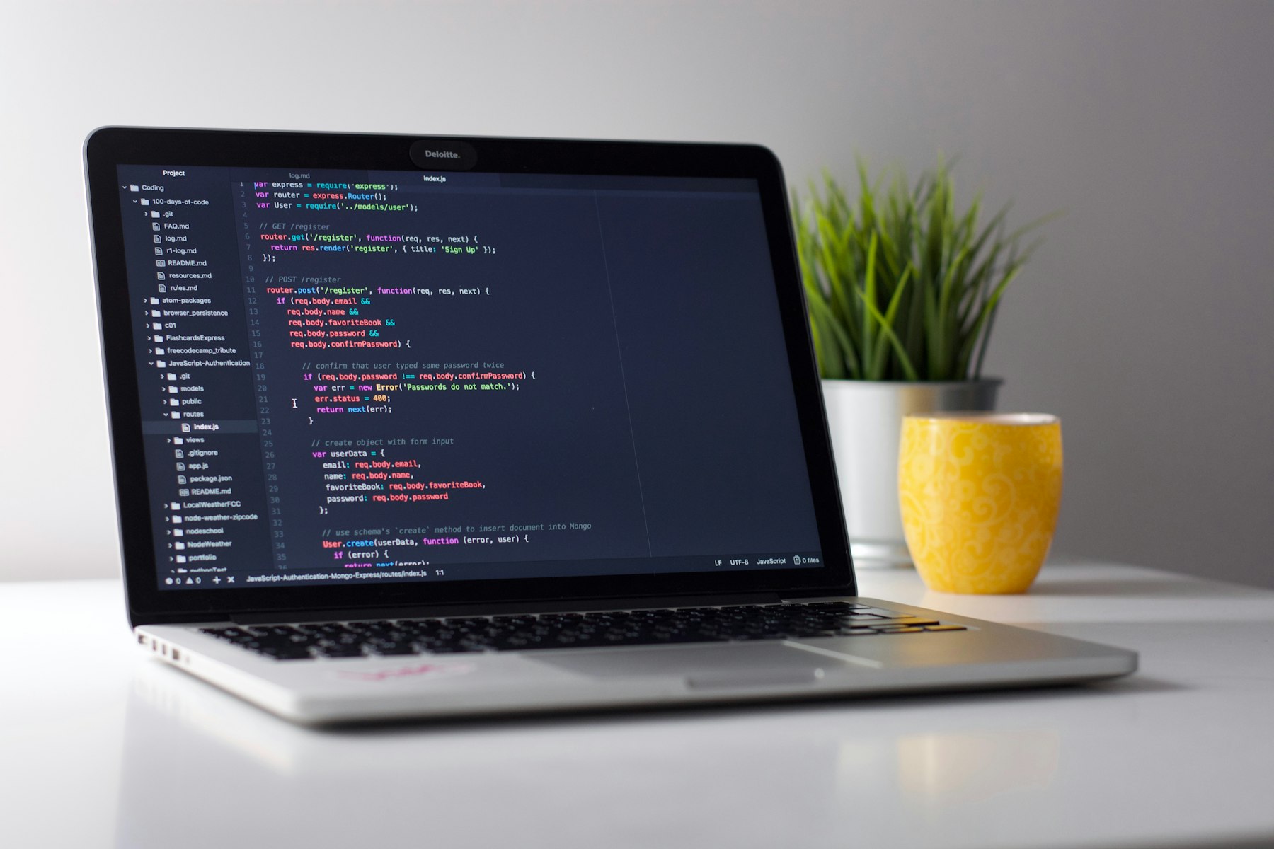 A developer monitor with code on a dark background