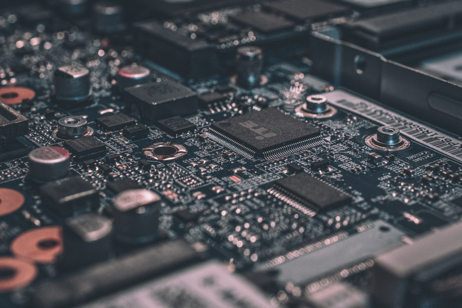 A close-up of a circuit board with bright accents