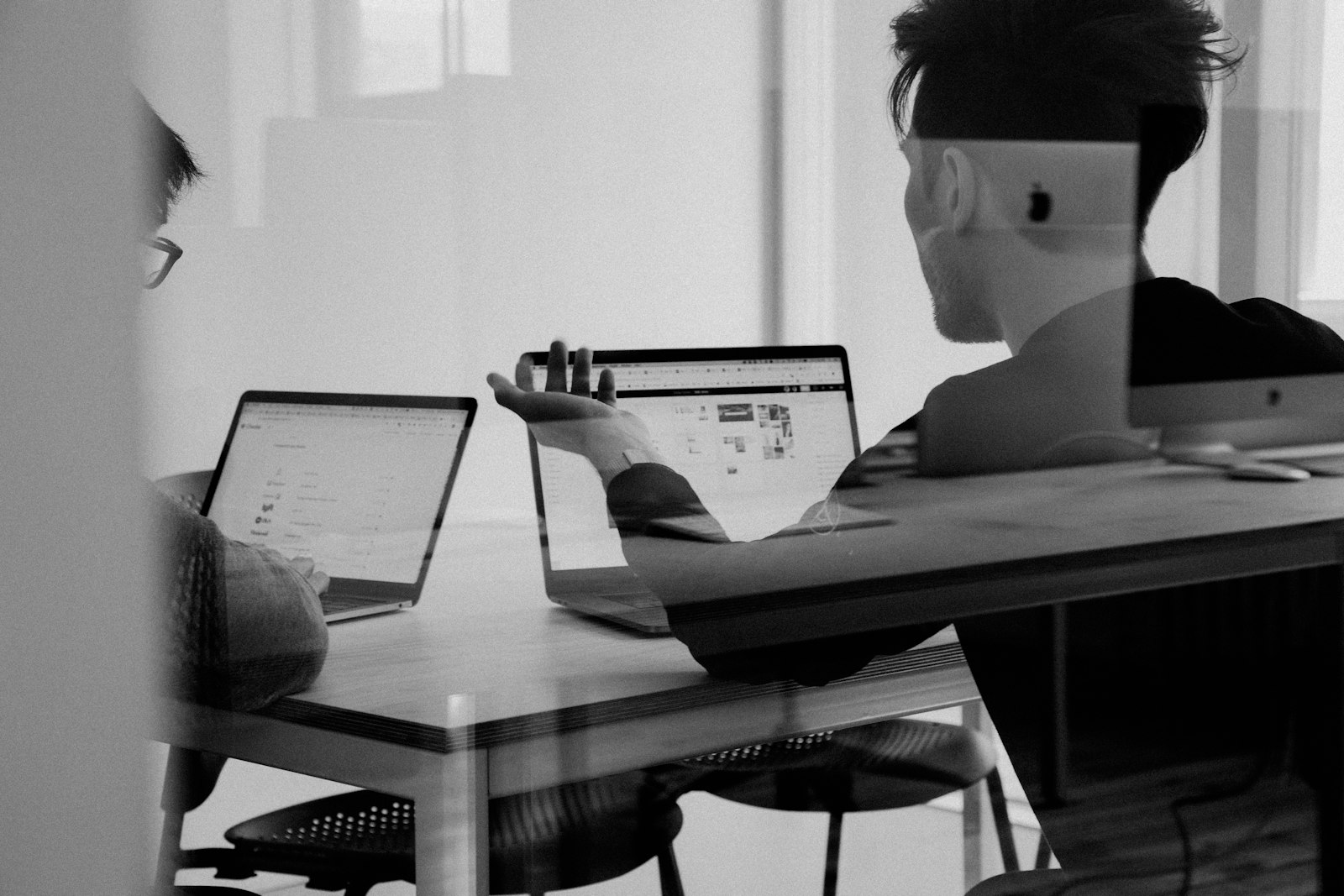 A person working at a laptop in an office